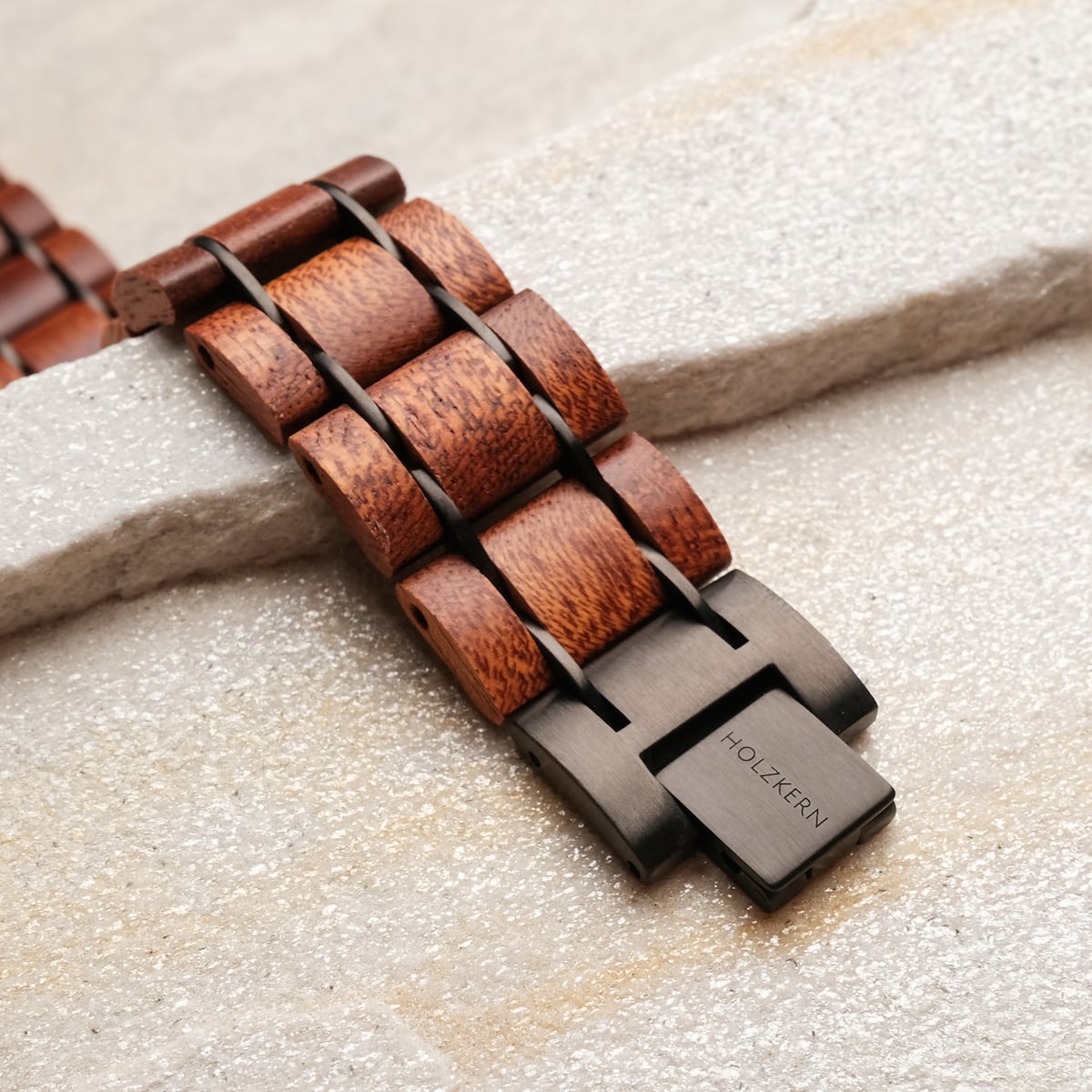 "Grandezza watch strap featuring a mahogany and gray design with a natural wood grain finish."
