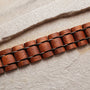 "Grandezza bracelet featuring a mahogany and gray design with a textured, natural look."