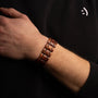 "Grandezza bracelet featuring a mahogany and gray design, showcasing a stylish and elegant look."