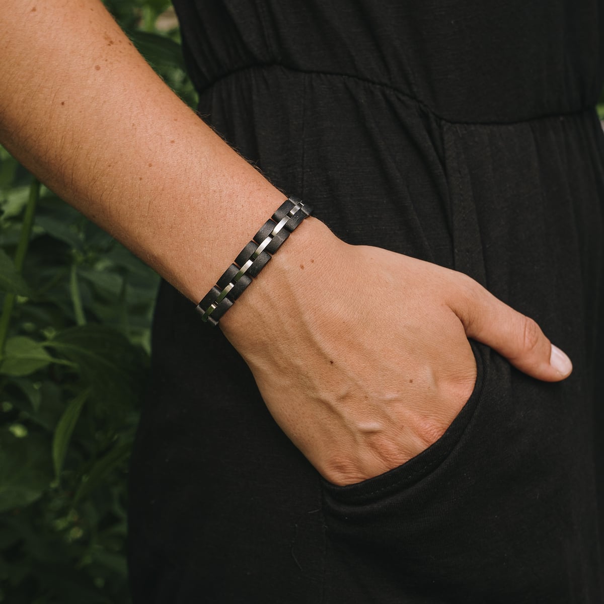 "Fantasia" bracelet featuring a sleek, woven Maple/Silver design.