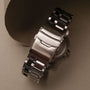 "Norium, a watch featuring a sleek marble and silver design with an elegant metal clasp."