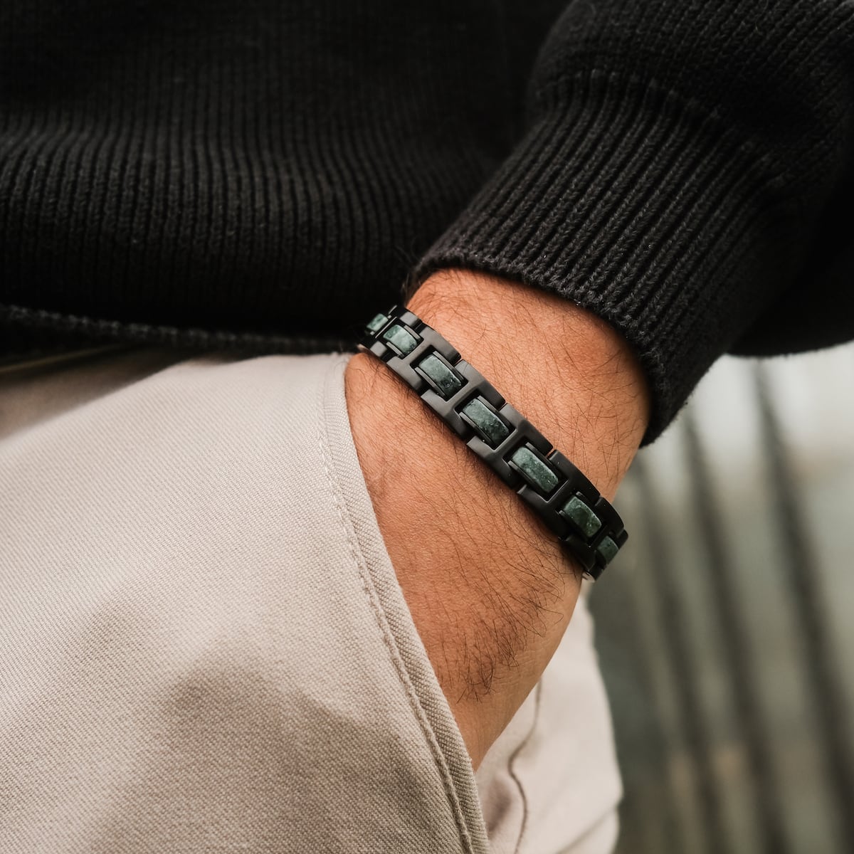 "Forte" bracelet in marble and black, featuring a sleek and modern design worn on a wrist.
