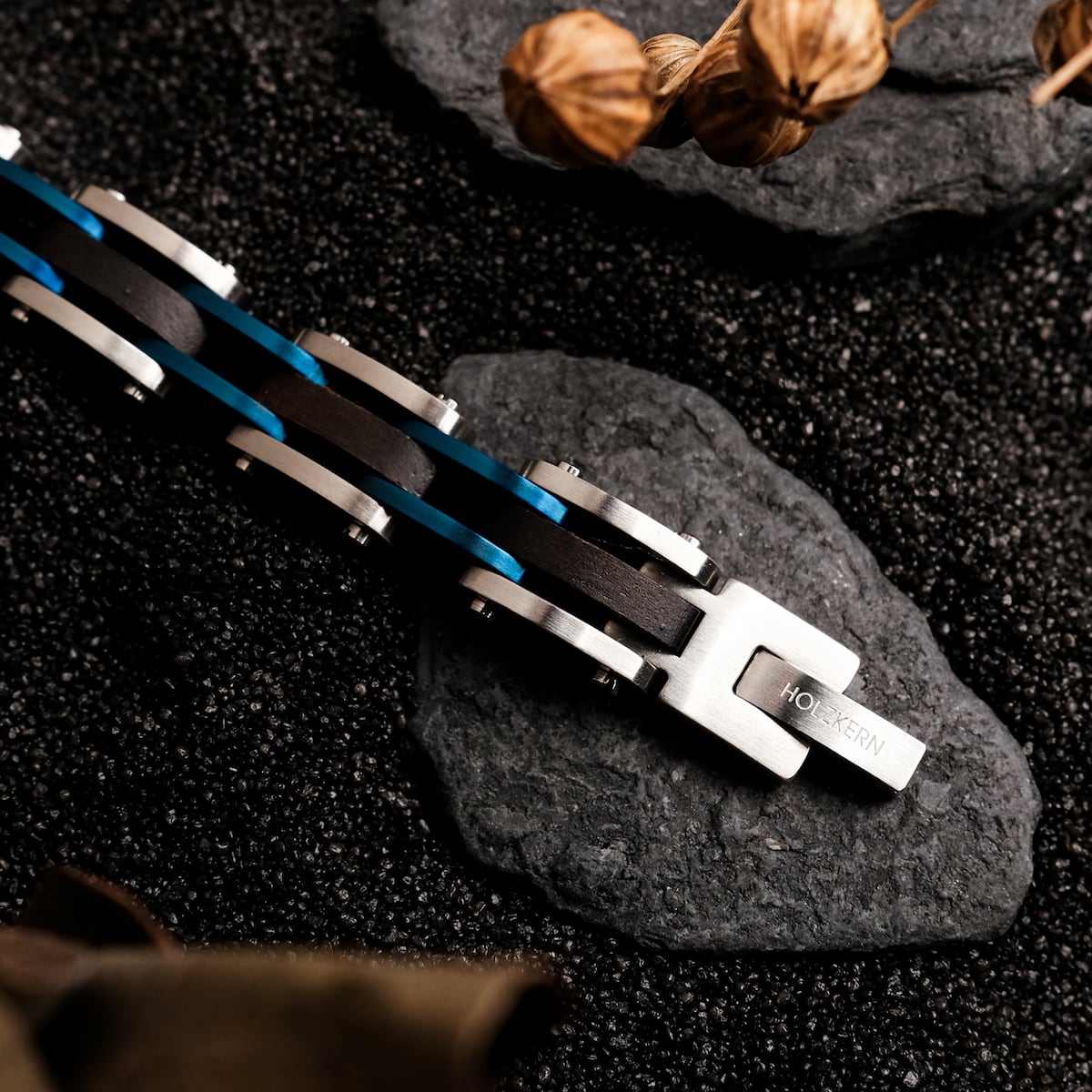 "Allegro", a stylish bracelet with maple and silver elements, featuring a sleek, modern design on a textured background.