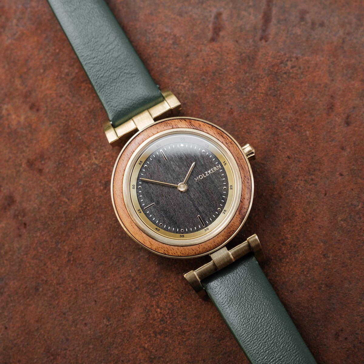 "Amelia" watch, featuring a rustic design with a Marblewood and Maple finish, complemented by a green leather strap.