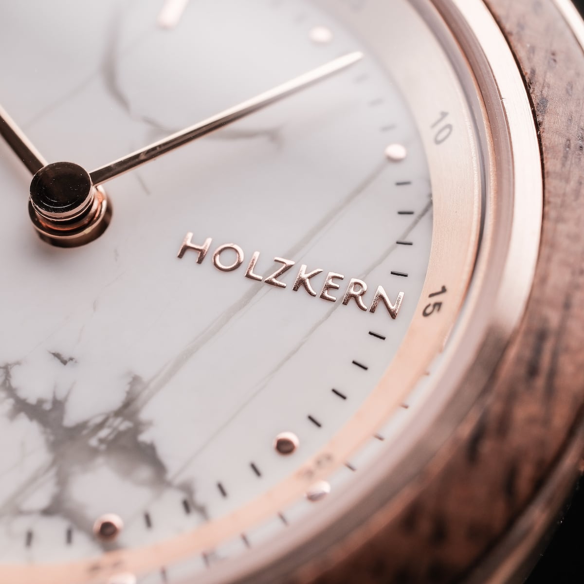 "Ida" watch featuring a walnut and marble design with elegant detailing.