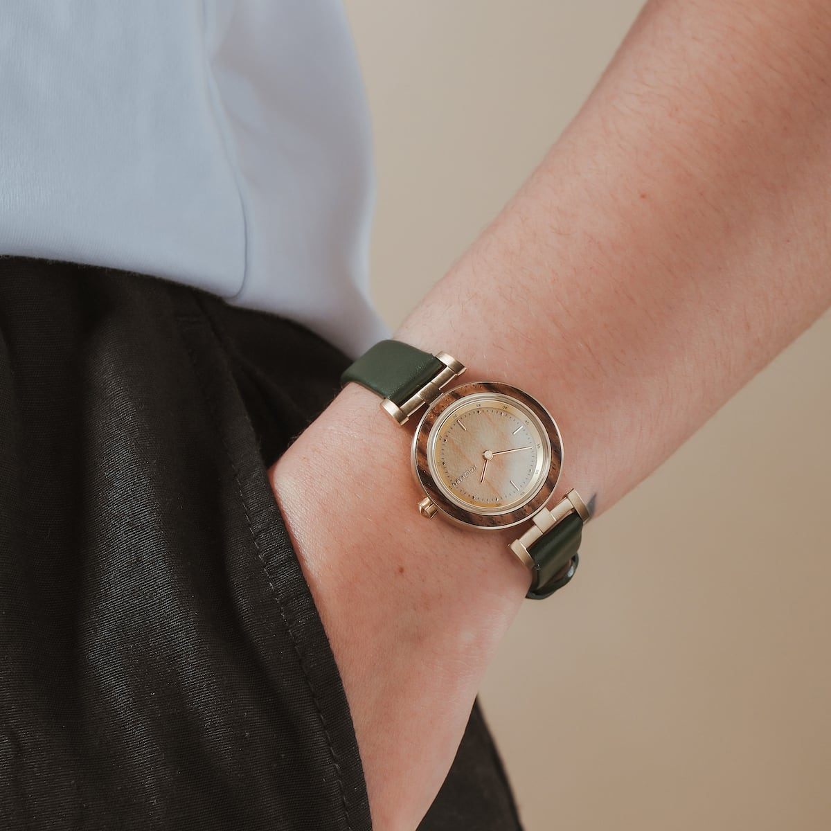 "Laura" watch with a natural wooden face and elegant, minimalist style.