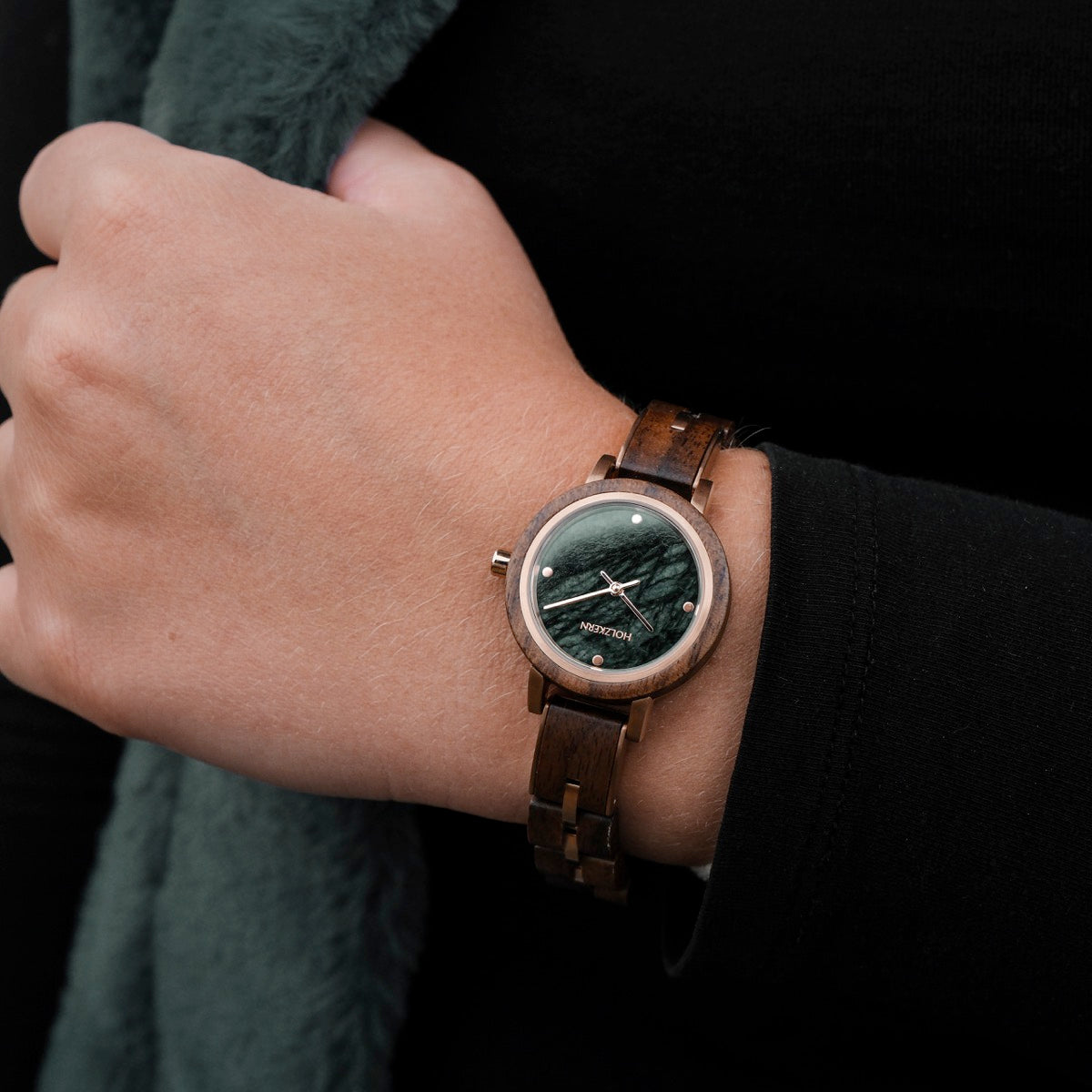 "Euterpe" watch features a walnut and marble design with a sleek, modern aesthetic.