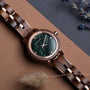 Euterpe wristwatch with a Walnut band and marble face, featuring an elegant and natural design.