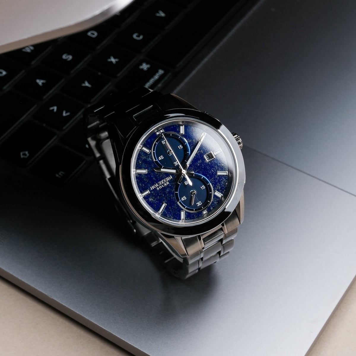 "Uplift" watch featuring a striking Lapis Lazuli dial and elegant Maple accents, set against a sleek metal band.