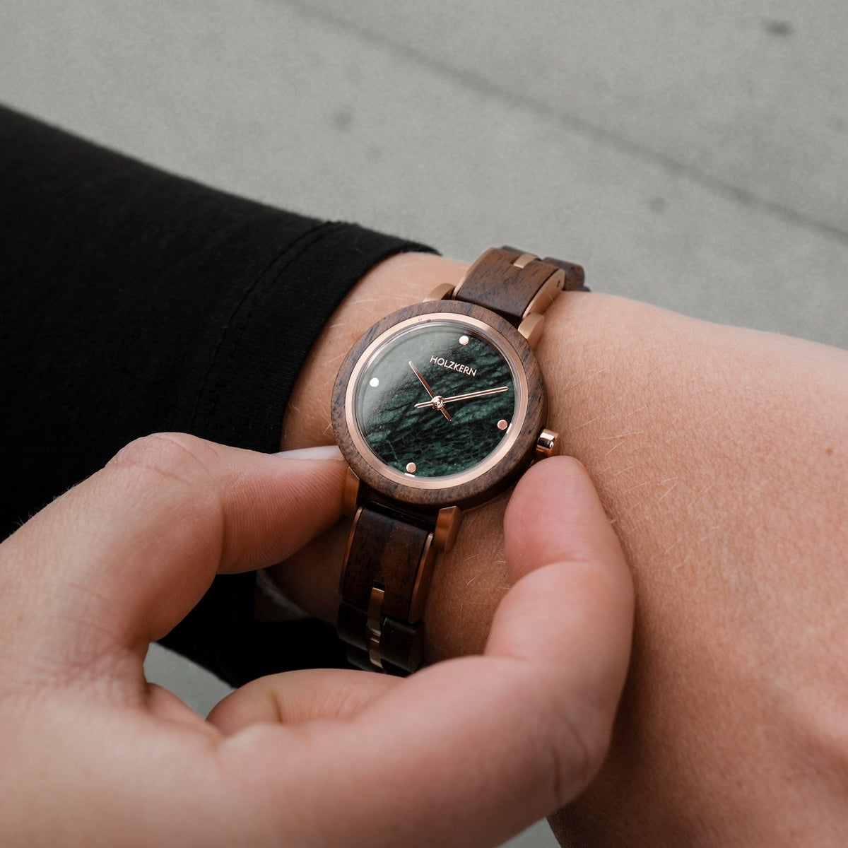 Euterpe watch with a walnut band and marble dial, showcasing elegant and natural design elements.