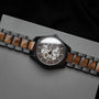 "Tenoumer" watch featuring a Koa and dark gray design with a distinctive skeletal dial.