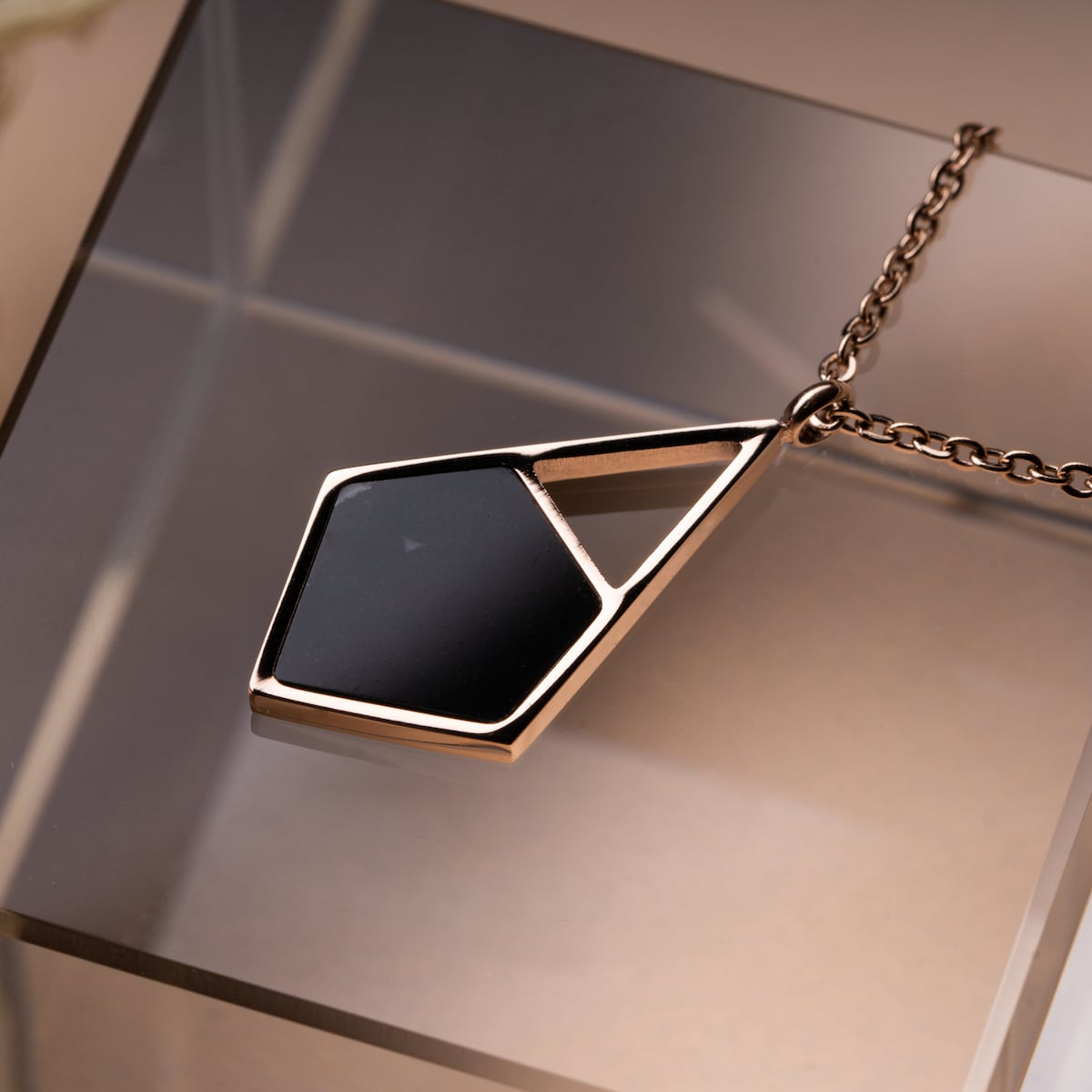 "Mandala Necklace, a geometric necklace, featuring a modern marble and rose gold design."