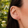 "Geometric Earrings": Elegant geometric earrings in walnut and rose gold design.