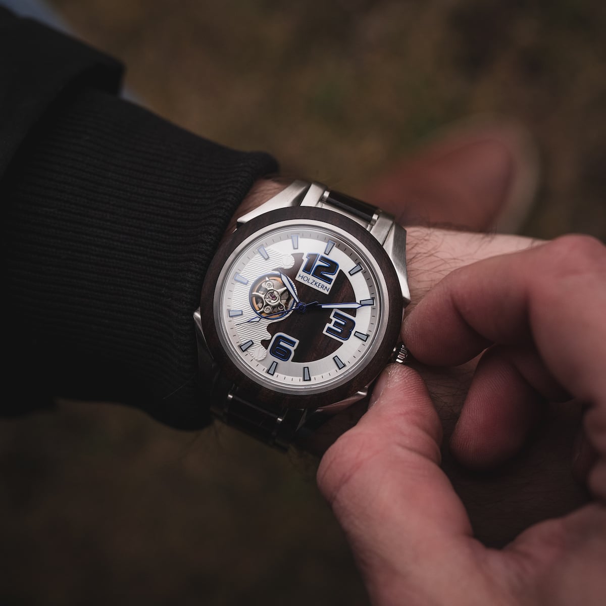 "Will" watch featuring a sleek, modern design with a Leadwood finish and bold blue accents.