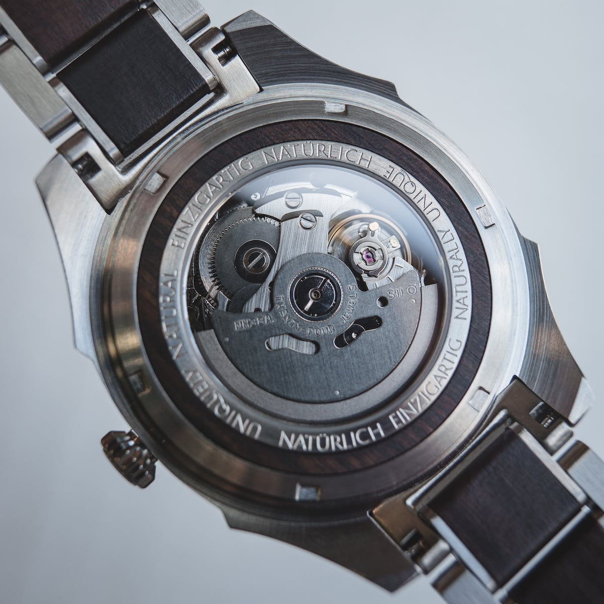"Will" watch displaying a sleek, metallic design with intricate internal mechanics visible through the back.